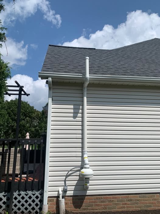Radon mitigation vent pipe installed on a home in Des Moines, IA